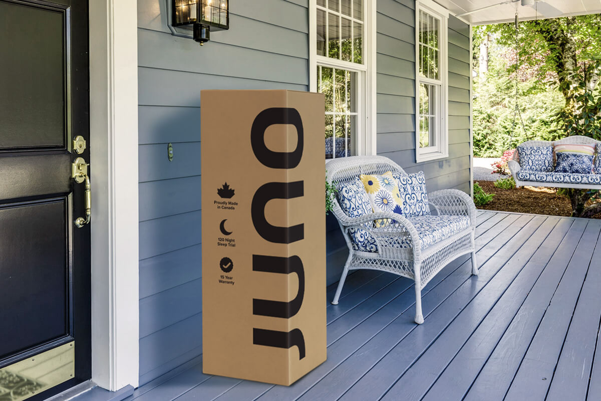 A Juno mattress in the delivery box on a front porch somewhere in Canada